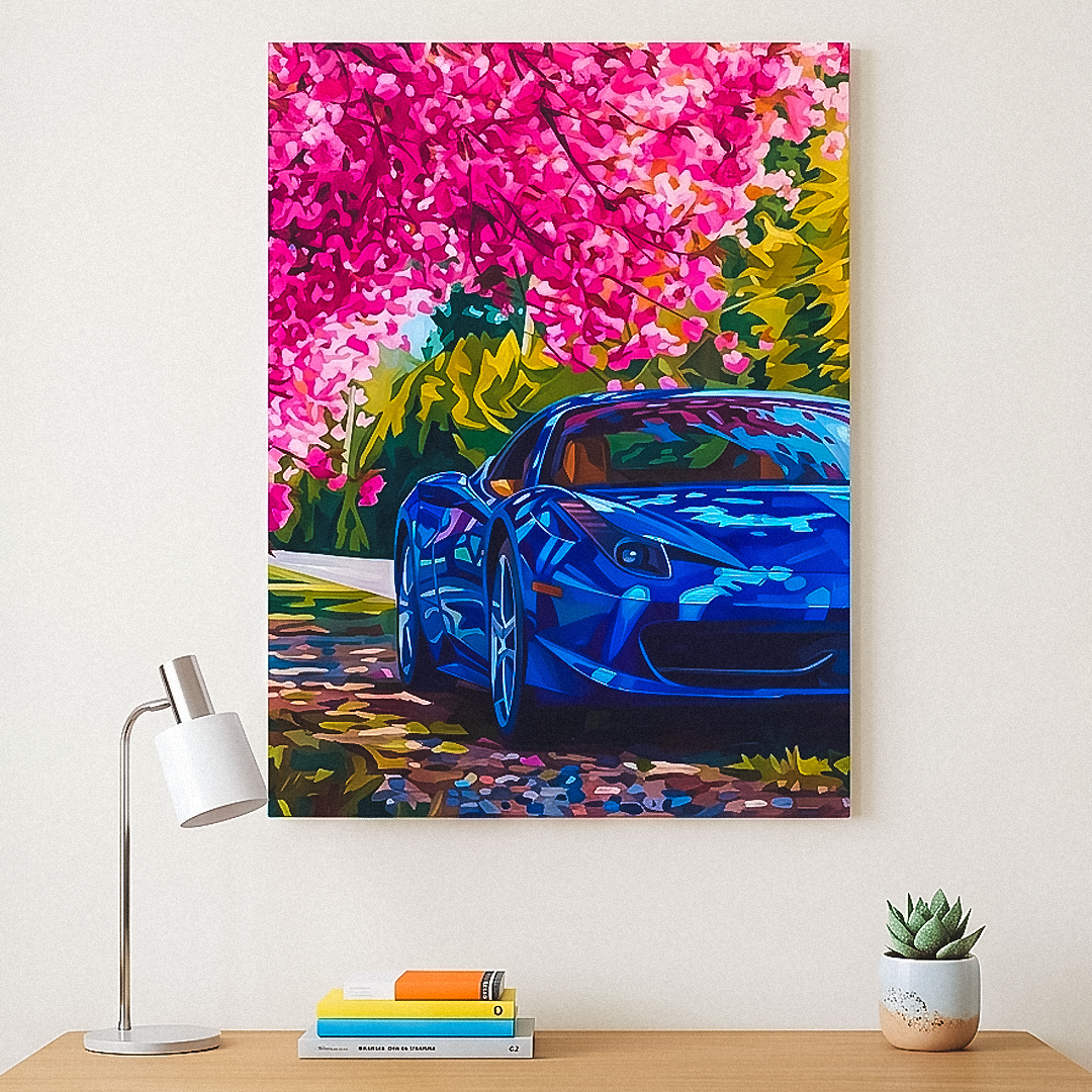 Colorful painting of a blue car among pink flowers on a wall above a wooden table with books and a lamp.