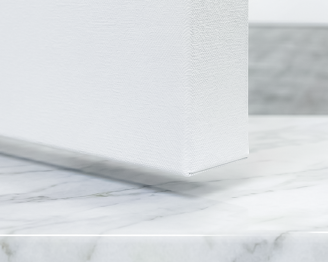 Close-up of a marble surface with a white frame.